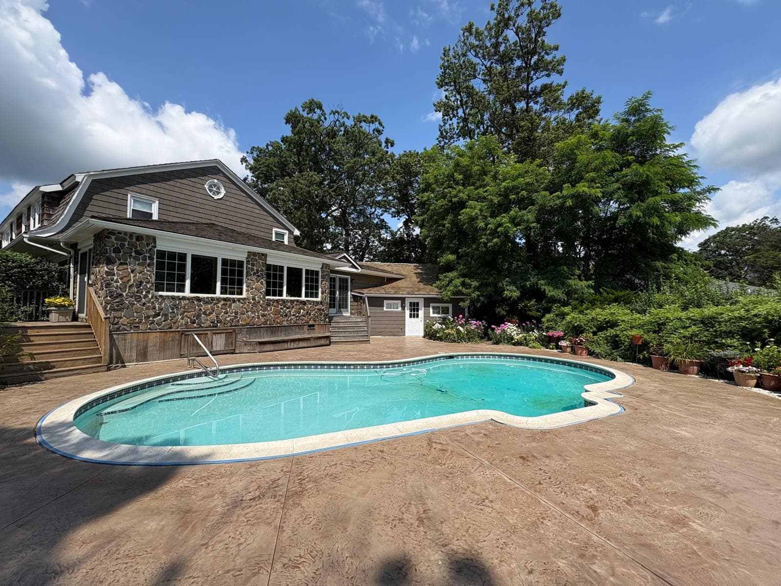 Luxury epoxy showroom floor with golden reflections and dramatic lighting