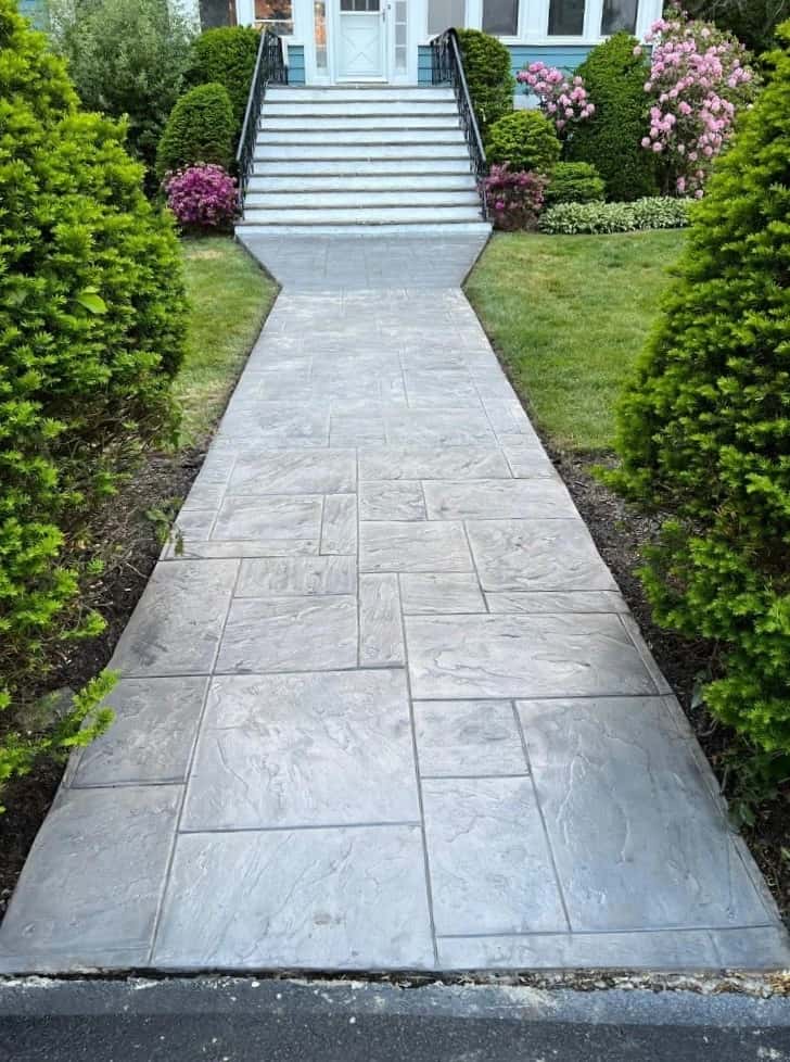 Decorative concrete contractor applying textured surface finish in New Jersey